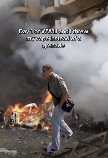 Man in front of a smoldering building looking distraught with the caption “Day 1 of WWIll and I threw my vape instead of a grenade”